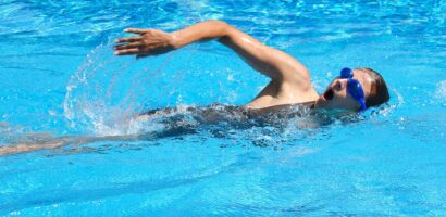 Young adult swimmer doing front crawl